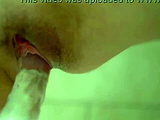 natural busty redhead masturbates closeup on clear dildo