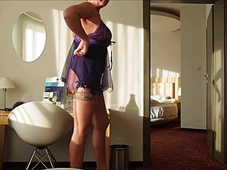 lady mona poses nude in tulle mini dress corset stockings heels