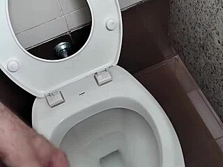 What lurks inside this public bathroom toilet stall? Solo amateur strokes small cock outdoors.